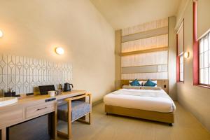 Letto o letti in una camera di HOTEL BEACON ONOMICHI
