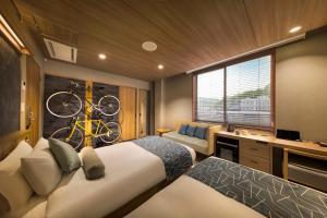 Letto o letti in una camera di HOTEL BEACON ONOMICHI