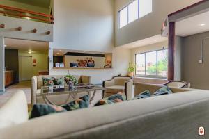 a living room with couches and a table at Coyote South in Santa Fe