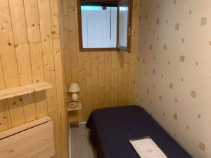 Кровать или кровати в номере Appartement Mont-Dore, 3 pièces, 5 personnes - FR-1-415-116