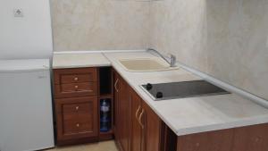 A kitchen or kitchenette at Beach Pool and Spa Apartment in Marina Cape