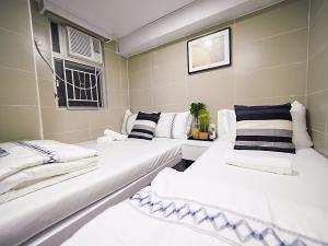 Katil atau katil-katil dalam bilik di Joyous Guest House