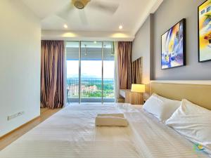 a bedroom with a large white bed with a window at Encorp Marina Puteri Harbour by RR JBcity in Nusajaya +63 photos