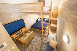 Letto o letti in una camera di HOTEL BEACON ONOMICHI