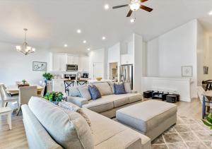 a living room with two couches and a dining room at Luxurious 6 Bedroom Home w/Garage Parking!Pets Too in Orem