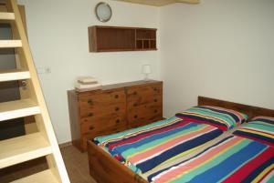 Postel nebo postele na pokoji v ubytování Cihlářská bouda, apartmán 307