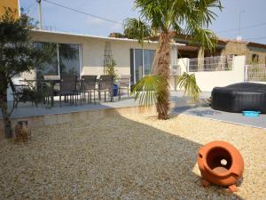 a house with a garden with a toilet in the yard at Casa Sant Miquel de Fluvià, 4 dormitorios, 10 personas - ES-89-91 in San Miguel de Fluviá