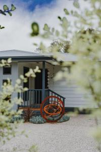 a house with a bench in front of it at Demure charm in Rye