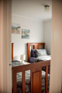 a bedroom with two beds and a door open at Demure charm in Rye
