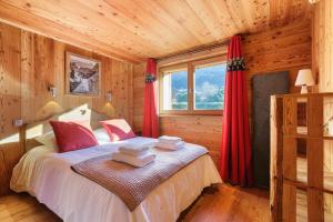 Posteľ alebo postele v izbe v ubytovaní Chalet de l'Alpage - Happy Rentals