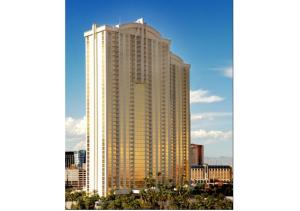 a tall building with a flag on top of it at Private Studio - No Resort Fee - The Signature at MGM Grand Tower B in Las Vegas