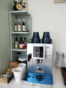 a coffee machine sitting on top of a counter at 葛萊絲鄉村小屋 Glass Country loft in Hsinchu City