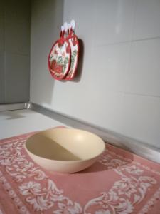 a bowl on a table with a plate on the wall at MountainAosta - CIR 0062 in Aosta