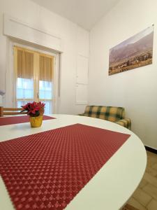 a room with a table with a red rug on it at MountainAosta - CIR 0062 in Aosta