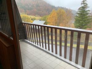 a balcony with a view of a mountain at Appartement Mont-Dore, 3 pièces, 6 personnes - FR-1-415-100 in Le Mont-Dore