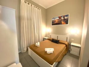 Postel nebo postele na pokoji v ubytování Golden Milano Hotel