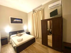 Postel nebo postele na pokoji v ubytování Golden Milano Hotel