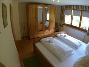 a bedroom with a bed with two pillows on it at Haus Post OG-Wohnung in Todtnau