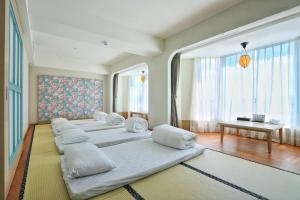 Voodi või voodid majutusasutuse Kenting Long Beach Hotel toas