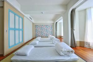 Voodi või voodid majutusasutuse Kenting Long Beach Hotel toas