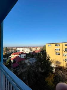 a view of a city from a balcony at LuanaApartments # 43 in Otopeni