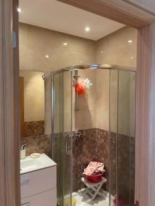 a bathroom with a shower with a sink and a toilet at Résidence Kettani bouznika in Bouznika