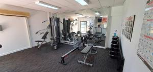 a gym with cardio equipment in a room at Heart of the City 504 in Perth