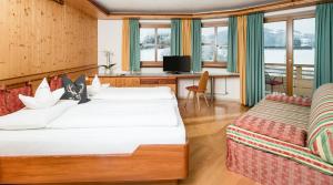 Posteľ alebo postele v izbe v ubytovaní Astor Apartments