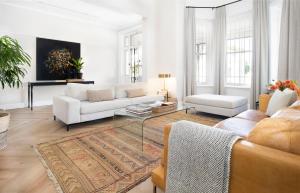 a living room with a couch and a table at Middedorp Manor in Stellenbosch