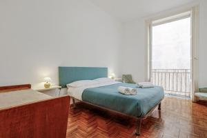 A bed or beds in a room at Teatro Massimo Lovely Flat with Balconies