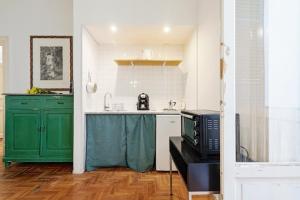 A kitchen or kitchenette at Teatro Massimo Lovely Flat with Balconies