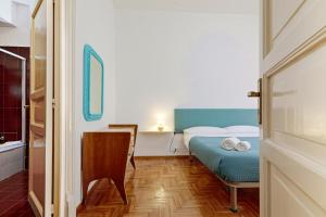 A bed or beds in a room at Teatro Massimo Lovely Flat with Balconies