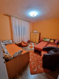 a small room with two beds and a couch at Hacijenda Milosavljević in Vrnjačka Banja