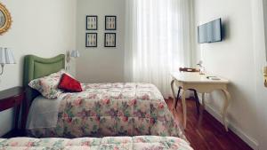 Postel nebo postele na pokoji v ubytování B&B CORSO VITTORIO