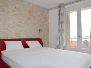 Ένα ή περισσότερα κρεβάτια σε δωμάτιο στο Grand appartement à Evian avec wifi et parking - FR-1-498-52