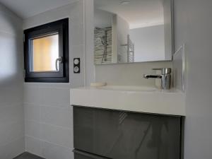 a bathroom with a sink and a mirror at Villa 5 chambres à Biscarrosse avec piscine chauffée, wifi, proche océan - FR-1-521-18 in Biscarrosse-Plage +15 photos
