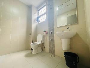 a bathroom with a toilet and a sink at Homestay 3BR near Setia Alam in Shah Alam