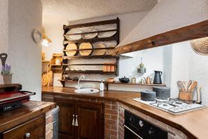 A kitchen or kitchenette at Arachova Wooden Chalet