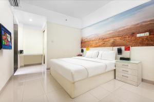 Cama o camas de una habitación en Jinxinwu Aparthotel Yuancun
