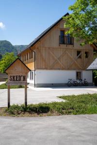 a large barn with two bikes parked in front of it at SKED'N in Bled