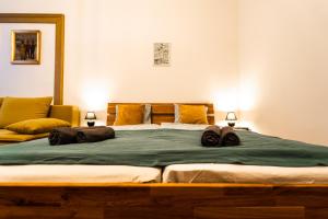 Posteľ alebo postele v izbe v ubytovaní Palace Quarter Suite