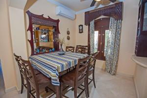 a dining room with a table and chairs at 4 Bed El Gouna Villa in Hurghada
