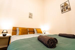 Posteľ alebo postele v izbe v ubytovaní Palace Quarter Suite