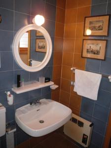 a bathroom with a sink and a mirror at Carezza Units, Dolomites in Carezza al Lago