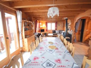 a dining room with a long table in a cabin at Chalet Bernex, 7 pièces, 16 personnes - FR-1-498-39 in Bernex