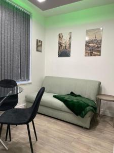 a living room with a couch and a table at Luis apartments in Leeds in Leeds