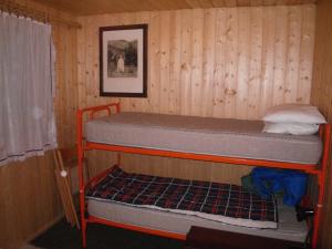 a room with two bunk beds in a cabin at Carezza Units, Dolomites in Carezza al Lago