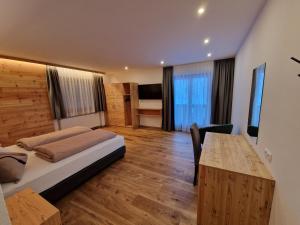 Ένα ή περισσότερα κρεβάτια σε δωμάτιο στο Hotel Mignon
