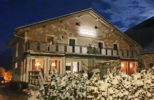 a building with a bunch of flowers in front of it at Chalet Taube in Bad Gastein