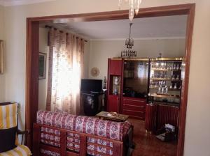 a living room with a couch and a window at Stunning House in Mirandela ideal for 10 people in Mirandela